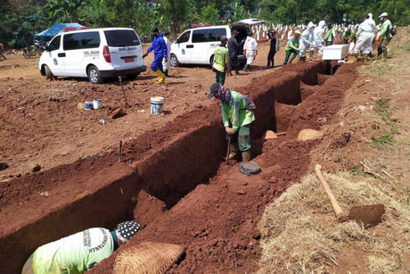 Anti-Maskers Forced To Dig Graves As Punishment In Indonesia