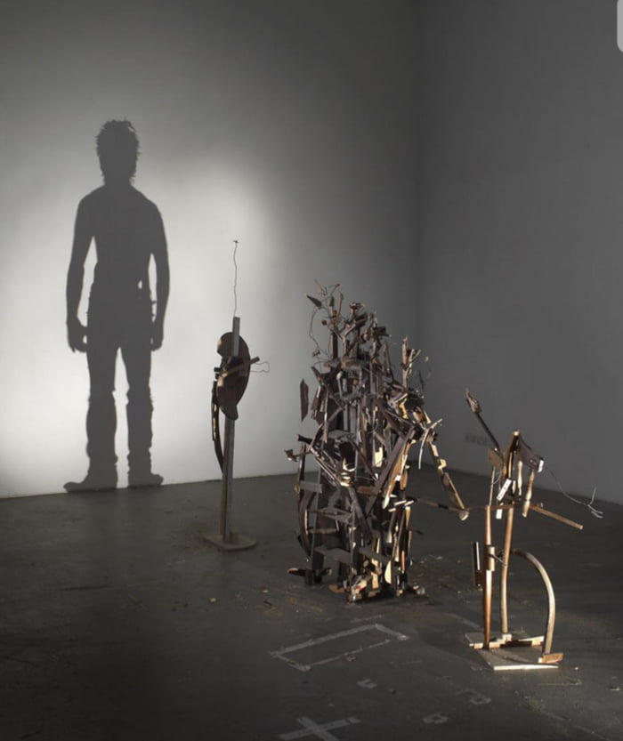 Artist duo Tim Noble and Sue Webster who recycle trash and animal carcasses to make shadow art