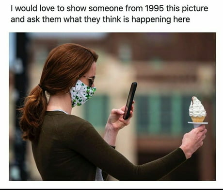 She's using her futuristic device to scan her ice cream like robo cop or some shit.