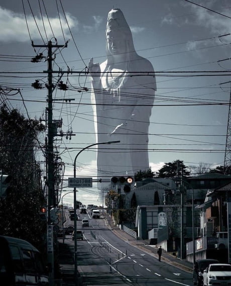 This is not a photoshop, but a 100-meter statue of the goddess Kannon located in Sendai, Japan. This is one of the tallest statues in the world.