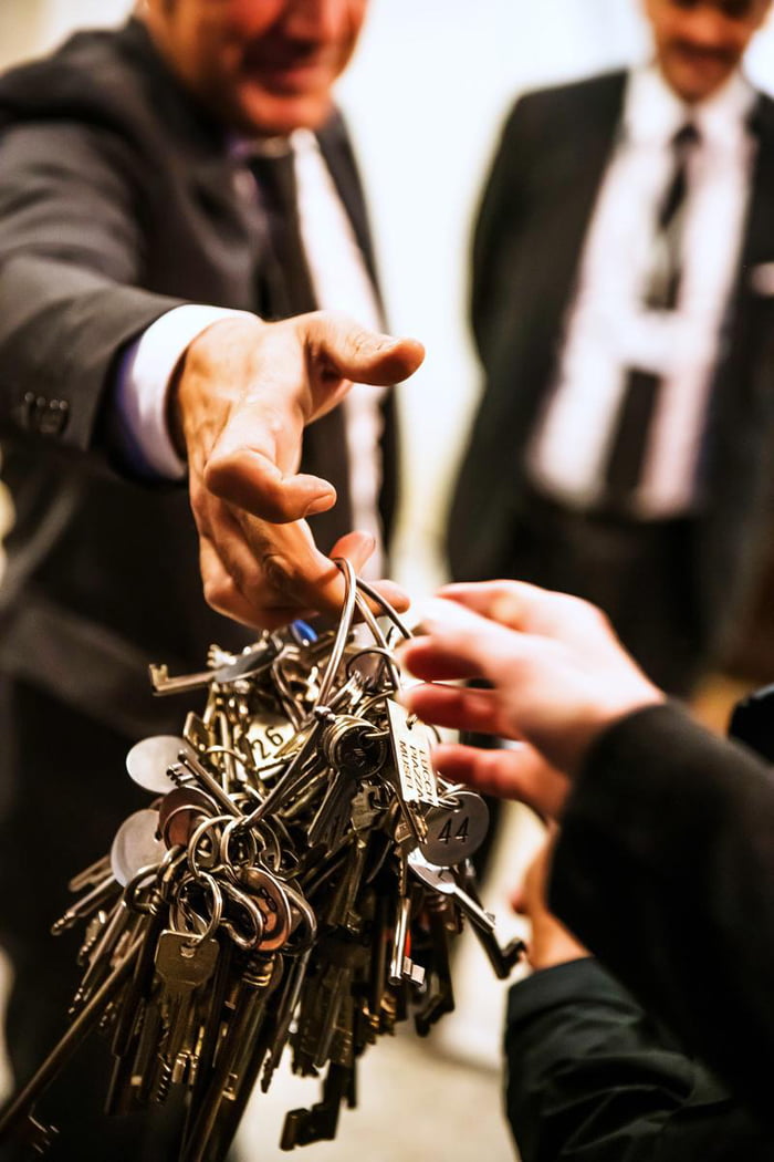 Vatican Key master, known as &quot;Clavigero&quot;, handing over a ring of keys that contains the original key for the Sistine Chapel.